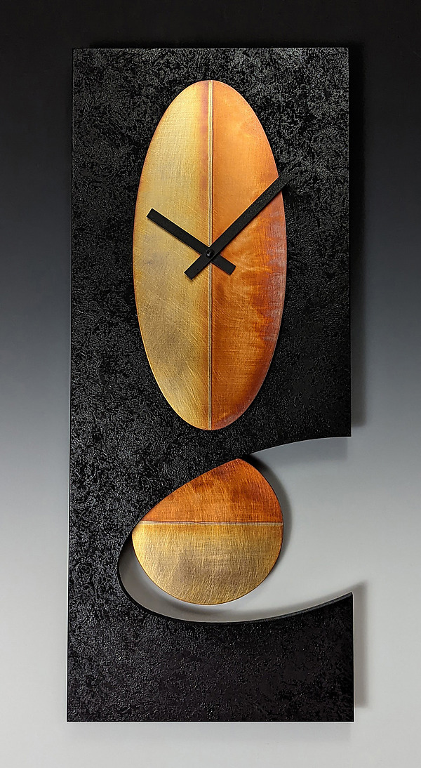 Black Oval Pendulum Clock by Leonie Lacouette (Metal & Wood Clock) | Artful Home